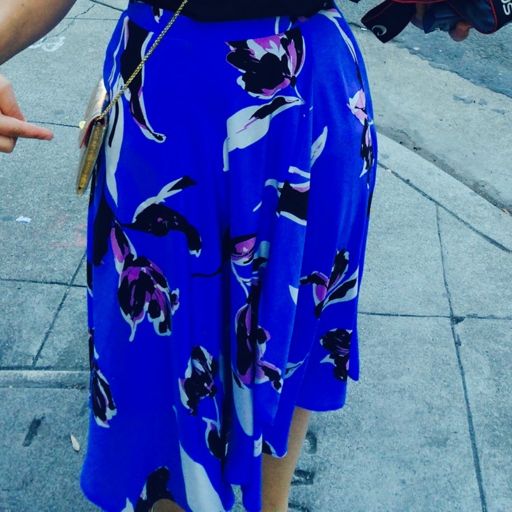 Yumi Kim silk skirt. Blue floral pattern and faux wrap style. Size medium.